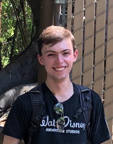 A picture of me at the Los Angeles zoo near the giraffe feeding area.